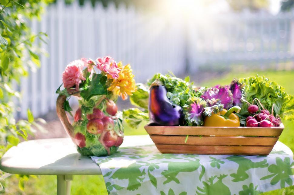 Free Image of Assorted Vegetables and Colorful Flowers in pitcher on table 