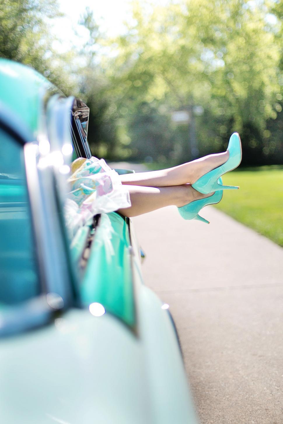Free Image of Turquoise car and woman legs 