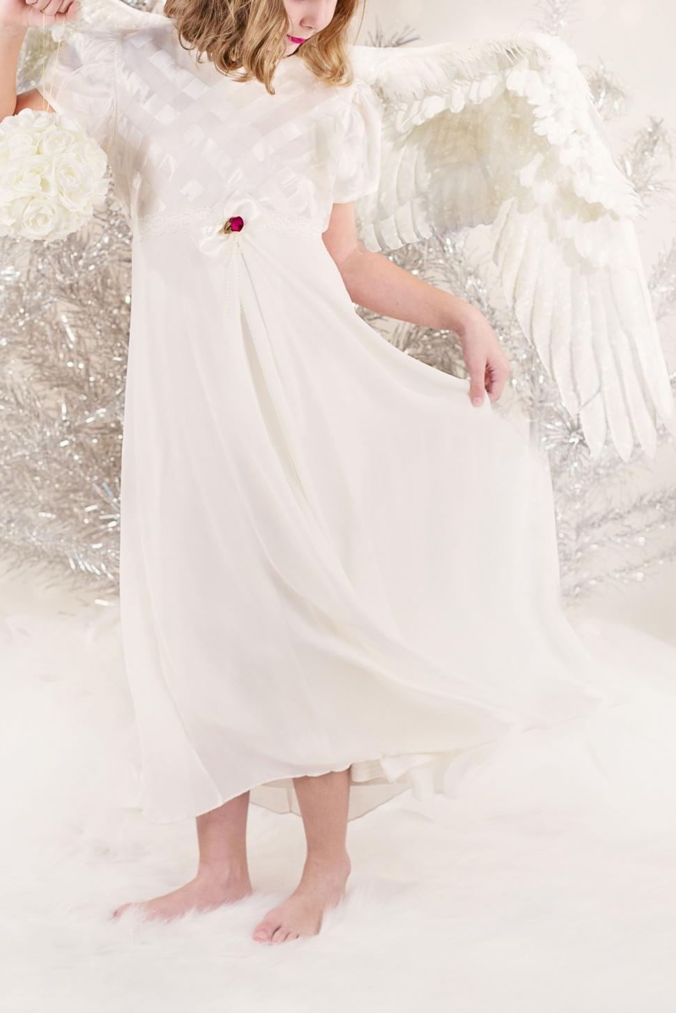 Free Image of Young Girl in Angle Dress 