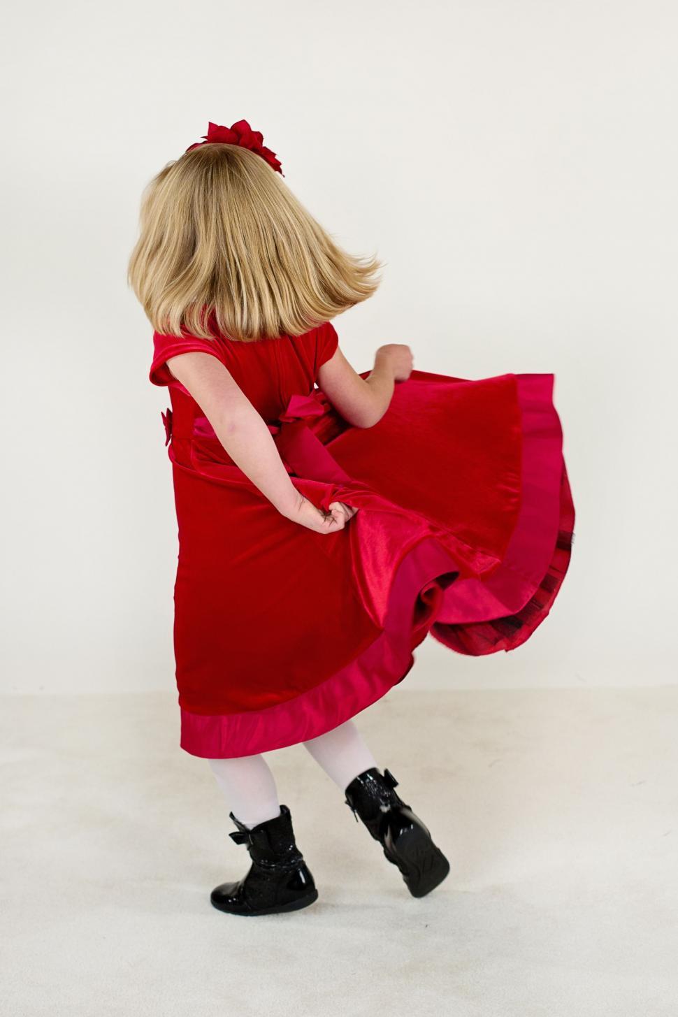 Free Image of Back view of little girl in black boots  