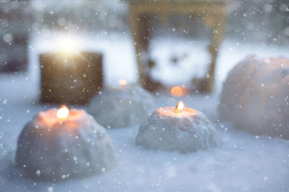 Free Image of Snowball candles in snow  