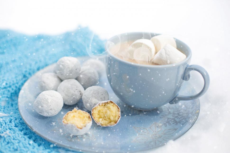 Free Image of Doughnut holes and Coffee on plate in snow  