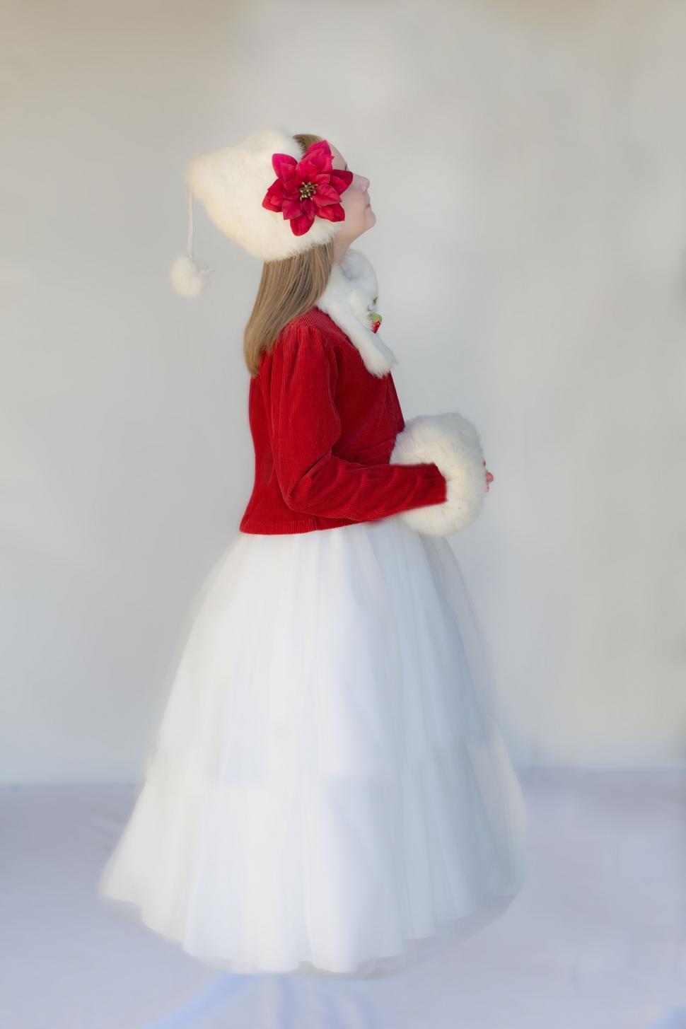 Free Image of Girl in red and white Christmas Dress 