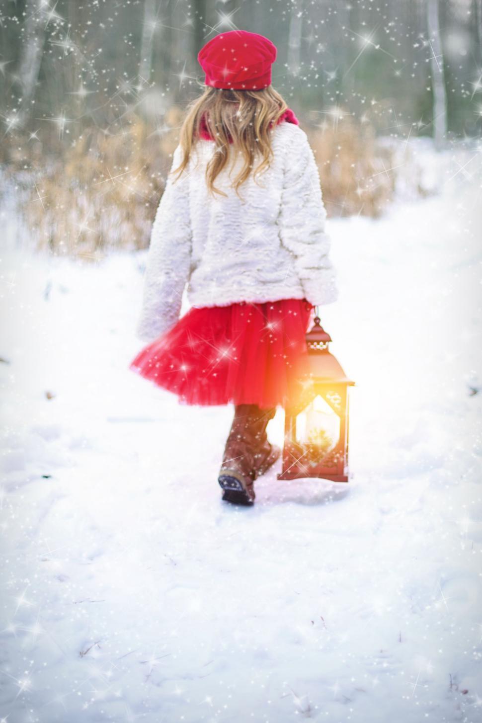 Free Image of Little Girl With Lantern in Snow 