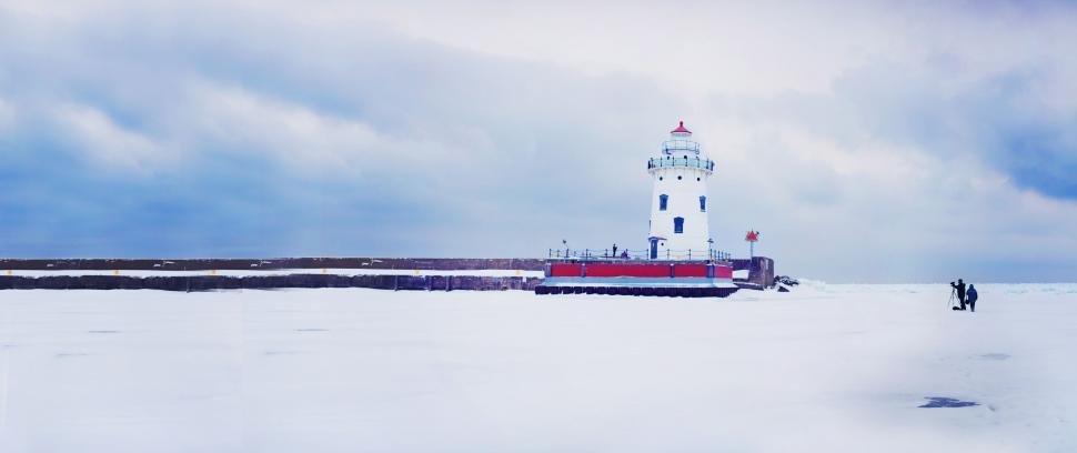 Free Image of Lighthouse and Snow with White Clouds 