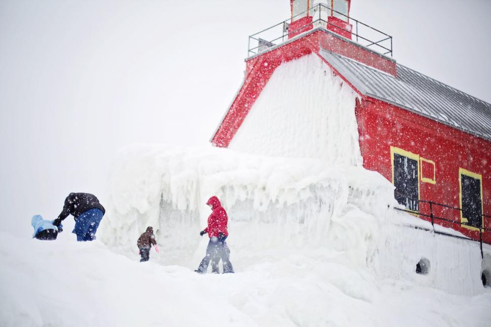Free Image of People and Lighthouse in Snow 