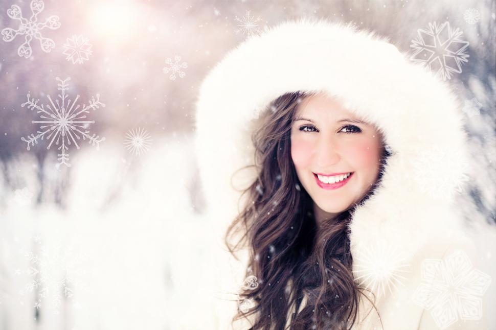Free Image of Woman in white jacket with Xmas snowflakes 