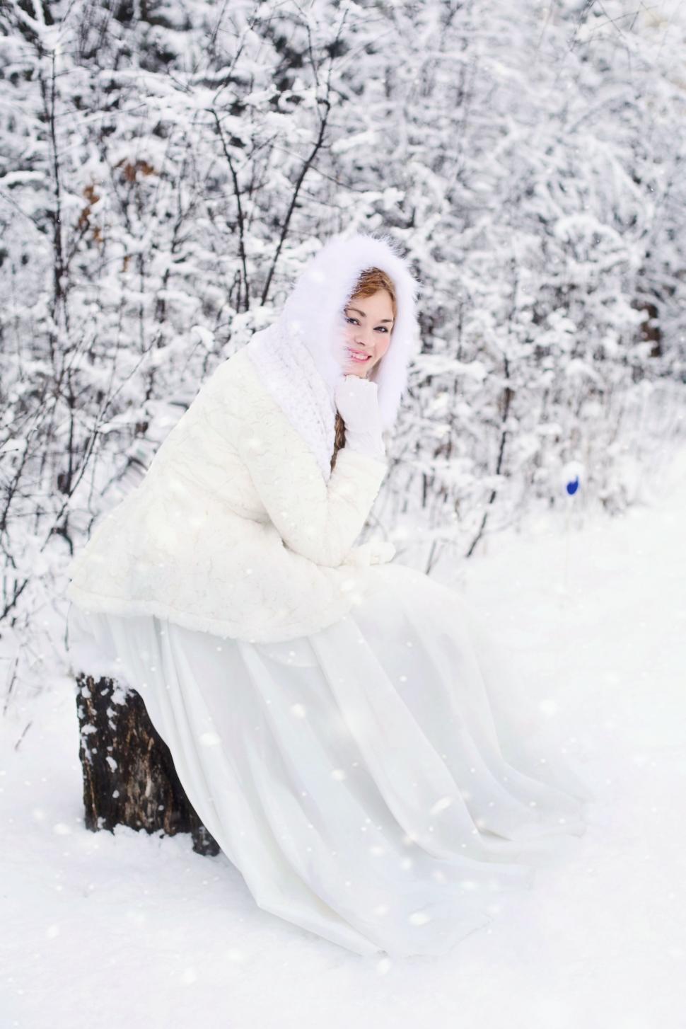 Free Image of Woman in White Gown with Snow - Looking at camera 