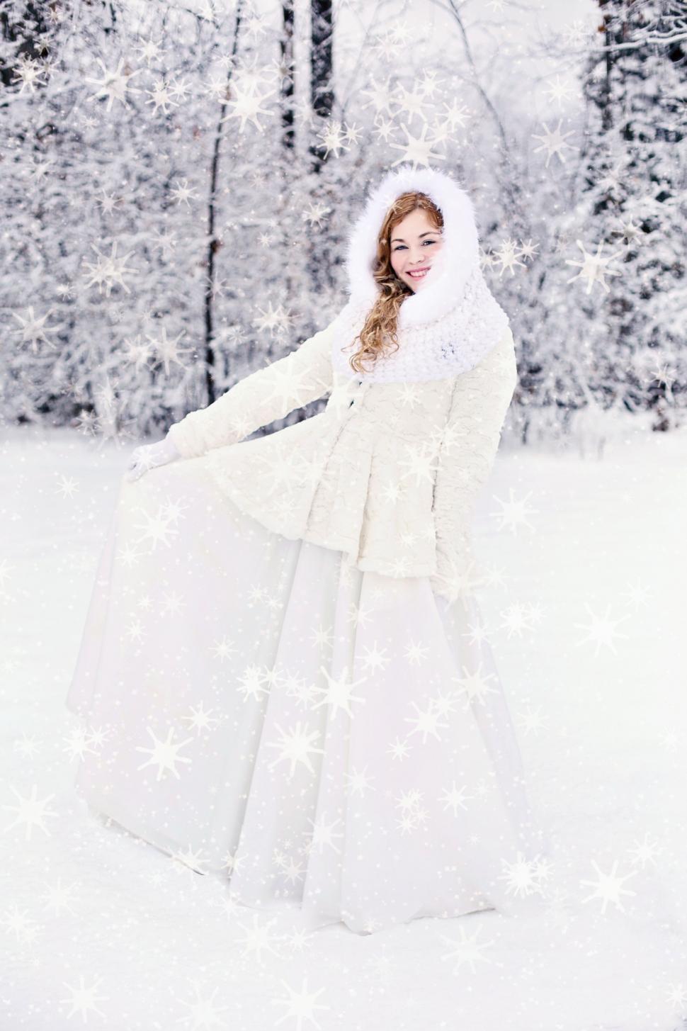 Free Image of Woman in White Gown with Xmas Snowflakes in Forest 