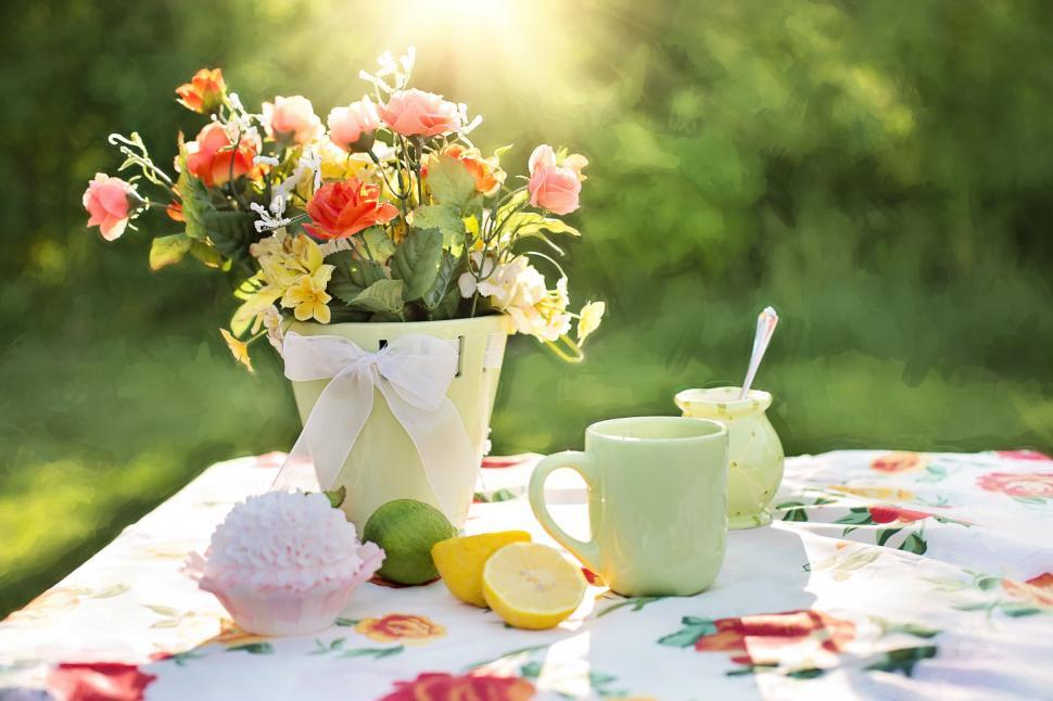Free Image of Cupcake and Flowers with Sliced Lemon 