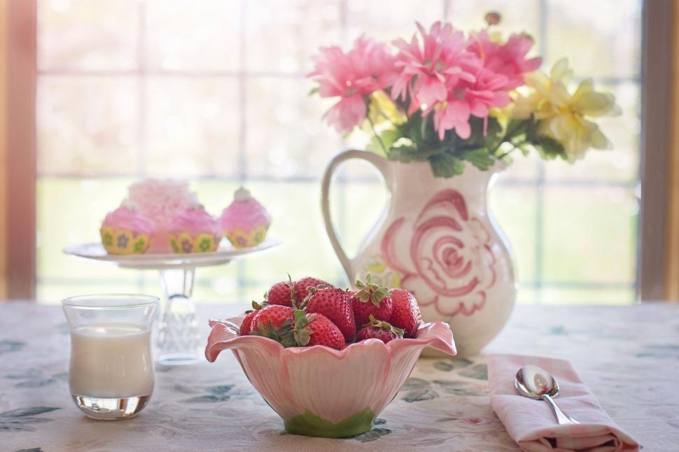 Free Image of Bowl of strawberries and flowers  