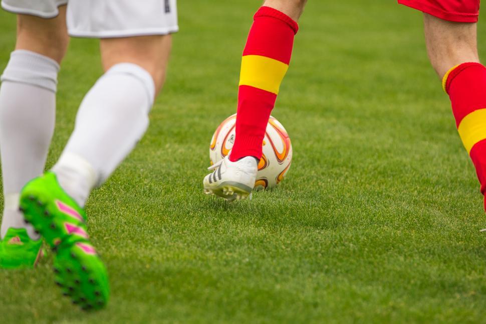 Free Image of Footballers leg, shoes and ball 