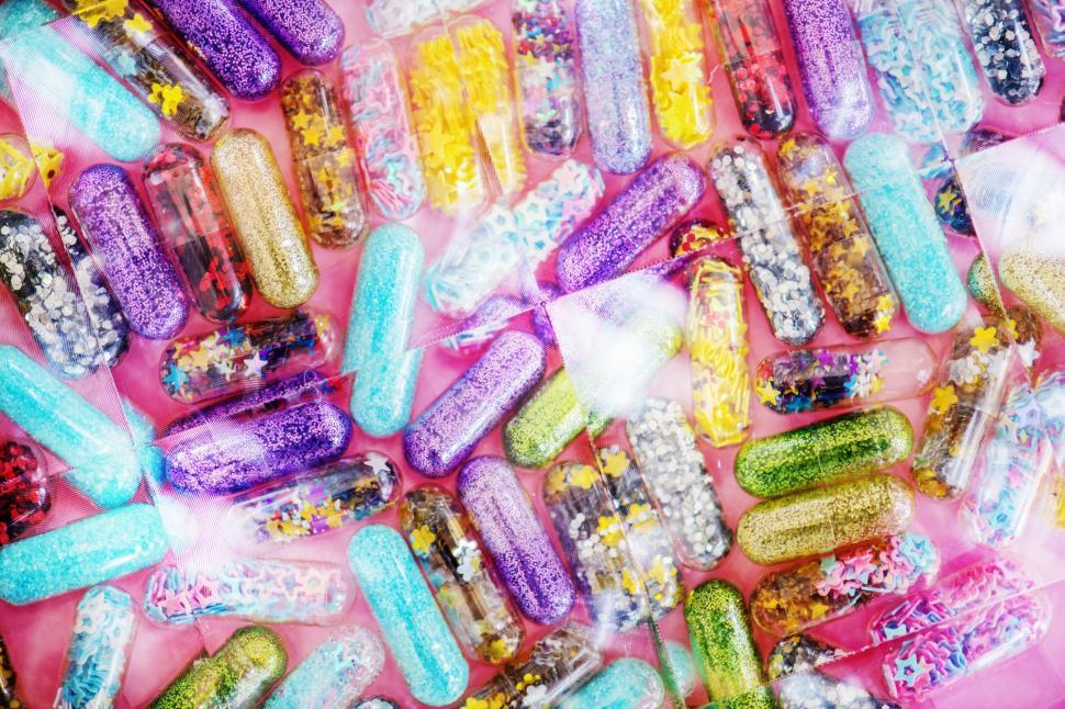 Free Image of Close up of glitter pills- background 