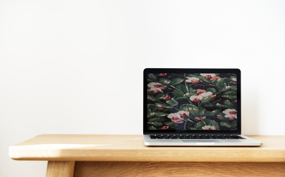Free Image of Close up of a laptop on the table - Floral pattern background 