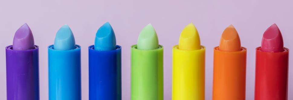 Free Image of Close up of bright colorful twisted up lip balm sticks 
