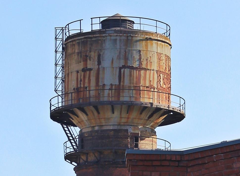 Free Image of Rusty Water Tank and Sky 
