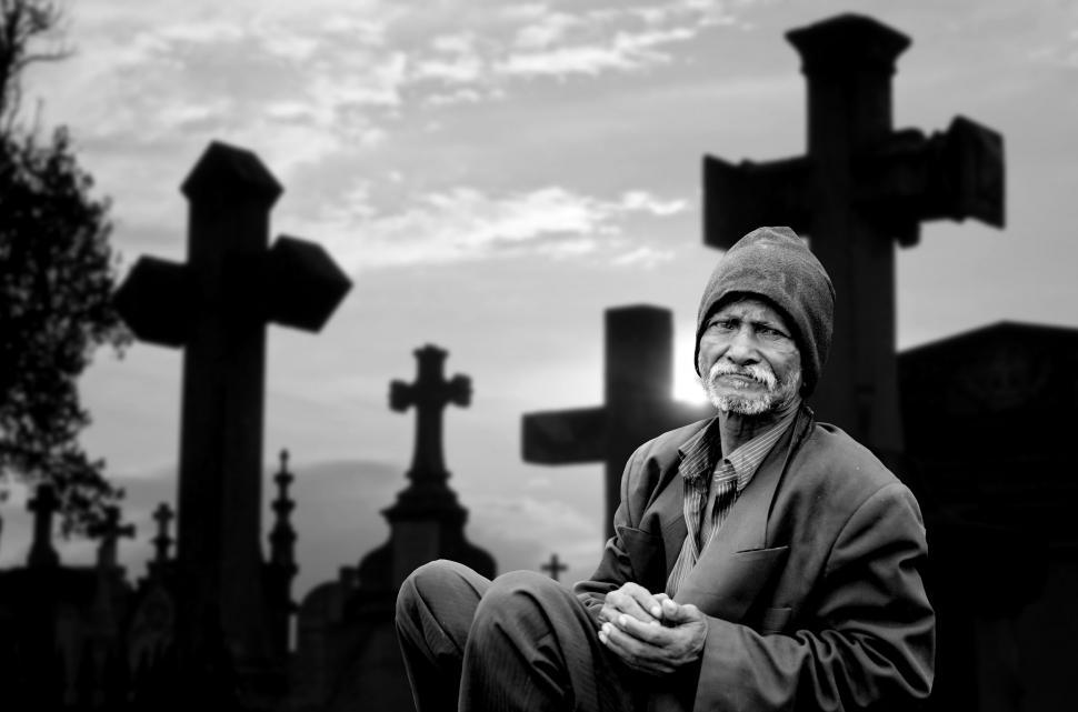 Download Free Stock Photo of Lonely Man Sitting at Graveyard - B&W 