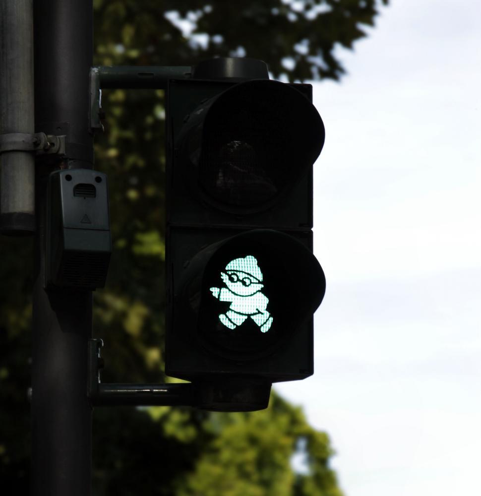 Free Image of Green little man and trees - traffic signal  