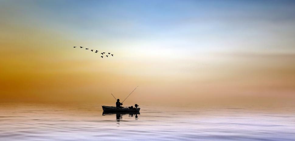 Free Image of Fisherman in Ocean with boat  
