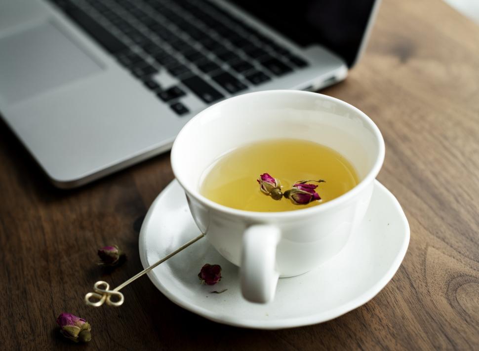 Free Image of Close up of a cup of herbal tea on saucer 