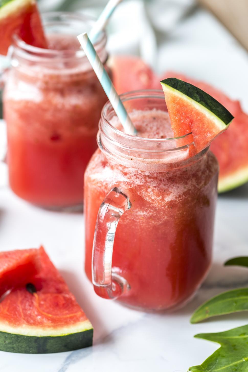 Free Image of Close up of watermelon smoothie in a jar with handle 