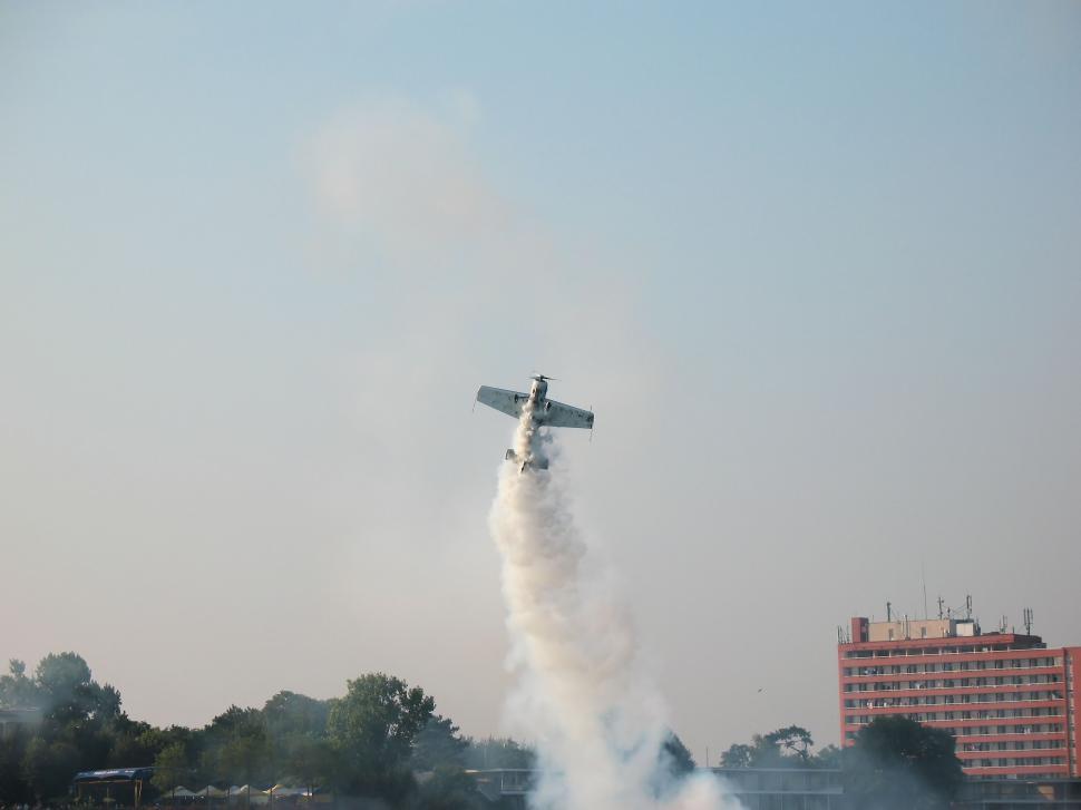Free Image of Aerobatic plane making loopings in the air 