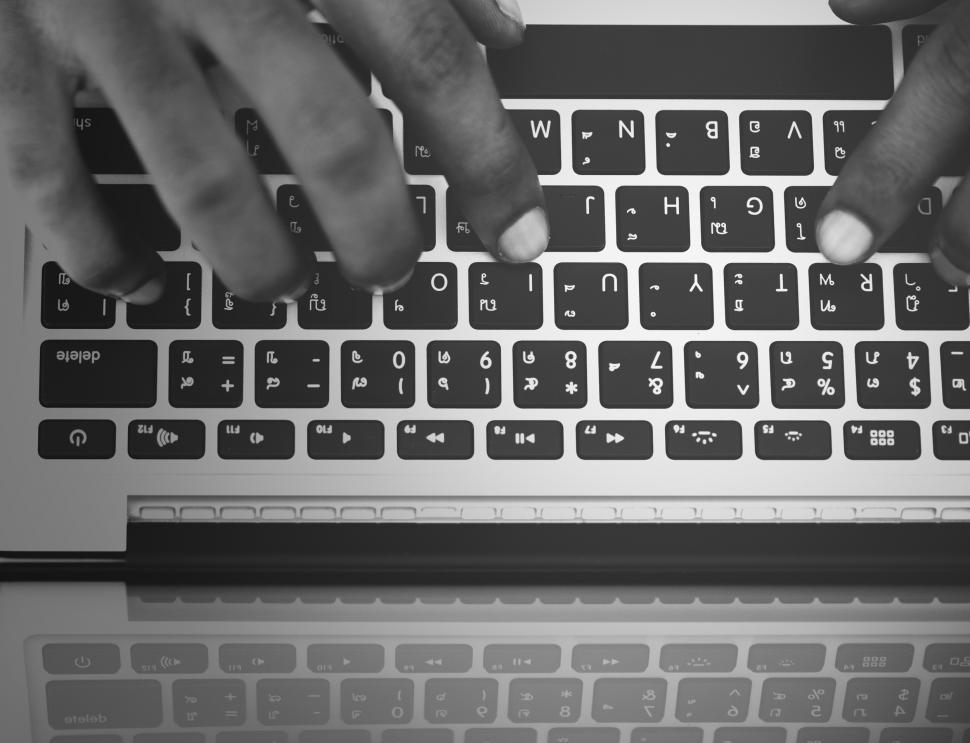 Free Image of A hands typing on laptop - close up of keyboard 