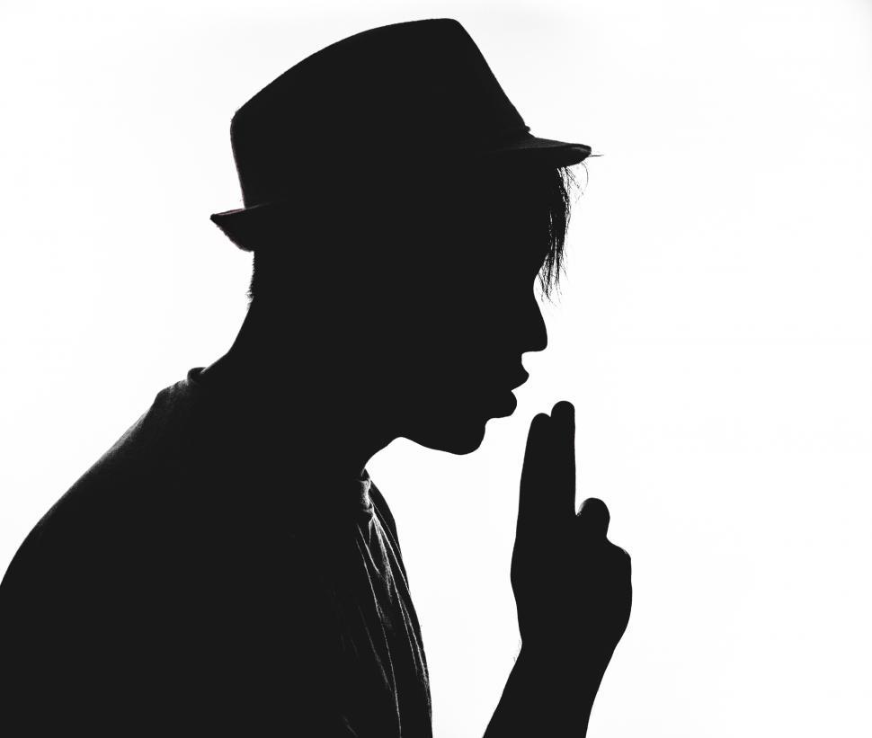 Free Image of Silhouette of a man pretends to fire a gun 