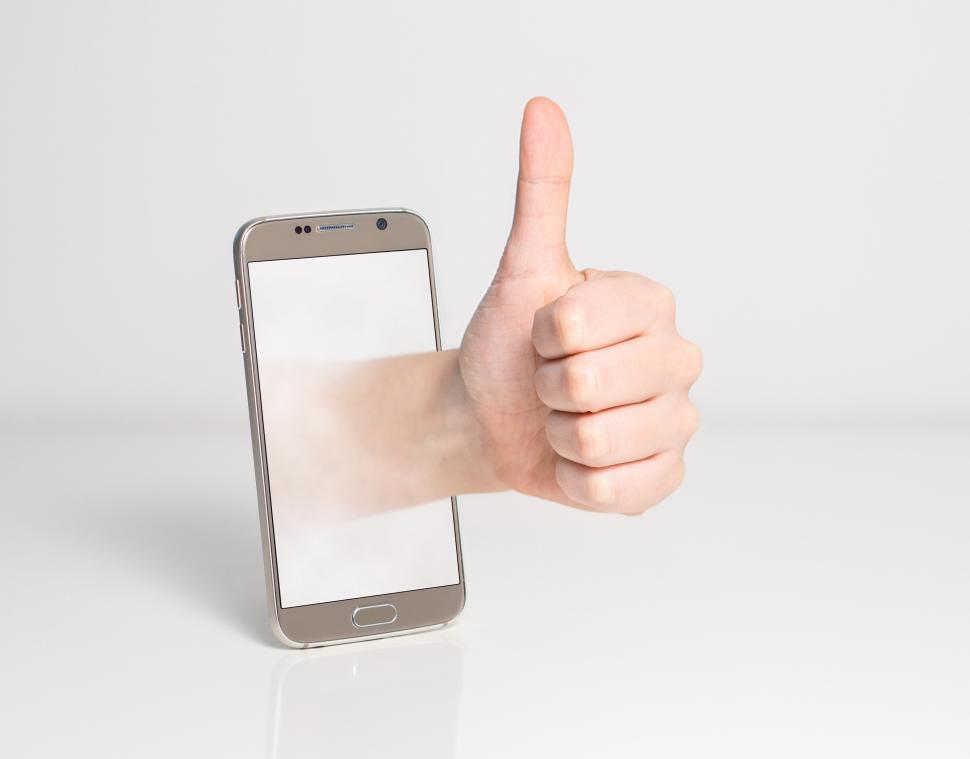 Free Image of Thumbs up and smartphone 