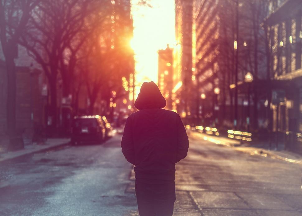 Free Image of Man Walking Alone on City Street 