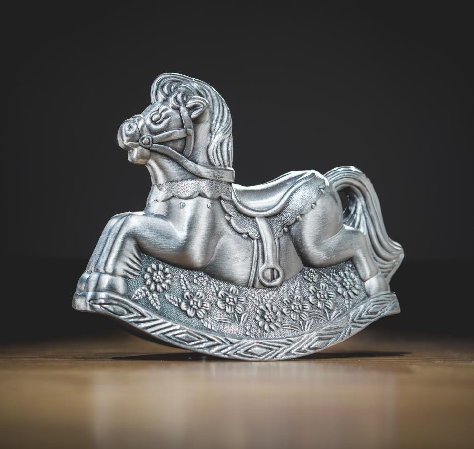 Free Image of A miniature metal rocking horse toy 
