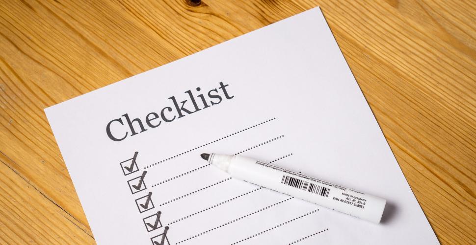 Free Image of Overhead view of a marker and a checklist - everything checked 
