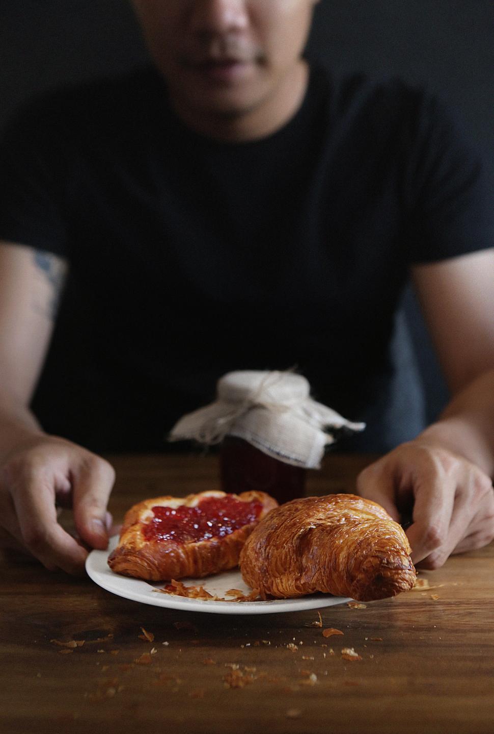 Free Image of Croissants filled with jam on breakfast table 
