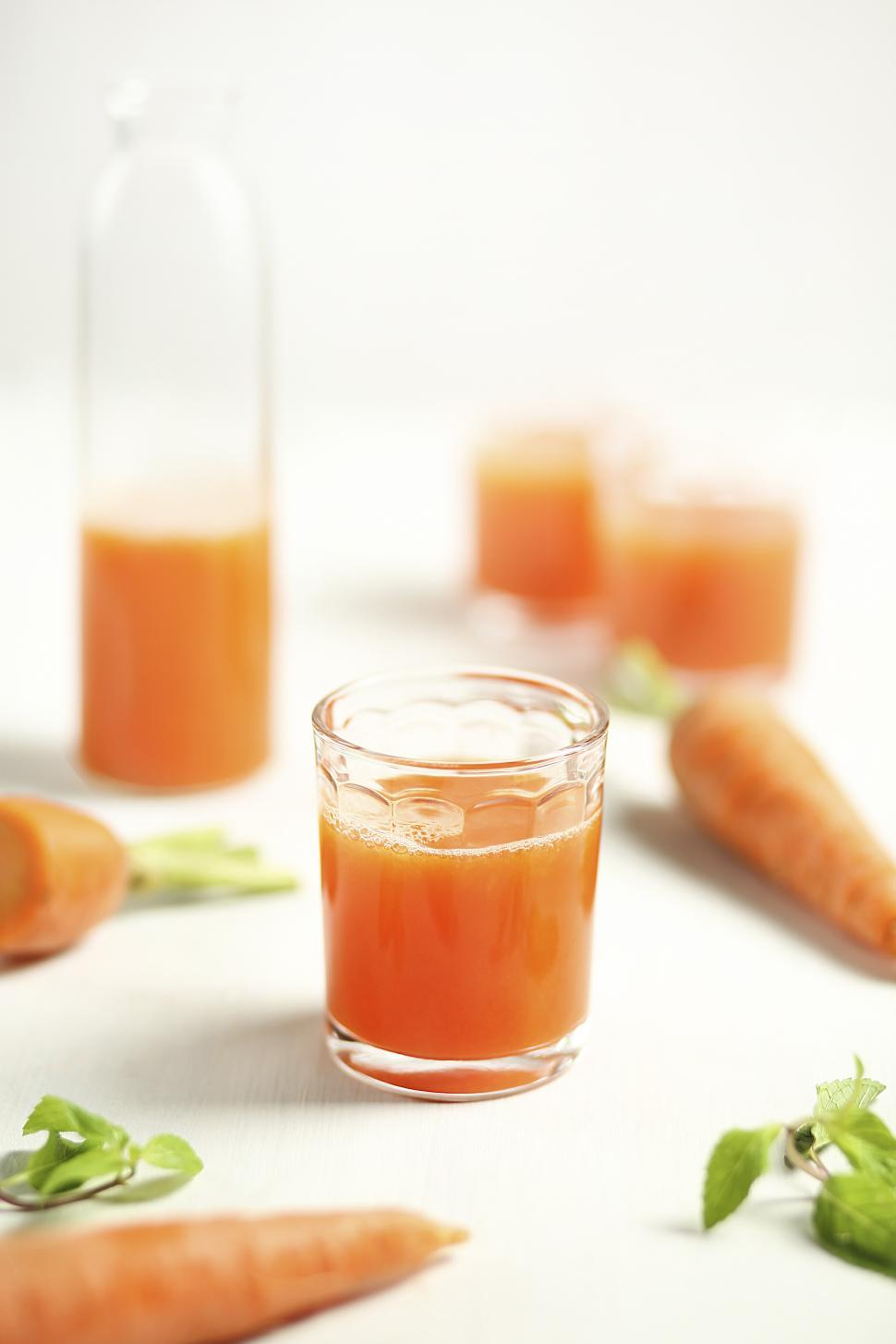 Free Image of Selective Focus on glasses of carrot juice 