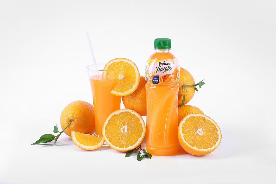 Free Image of Bottle of Tropicana twister orange fruit juice with sliced oranges 