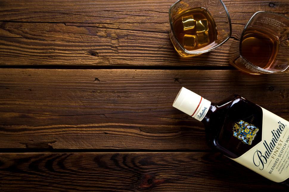Free Image of Overhead view of a whiskey bottle and glasses 