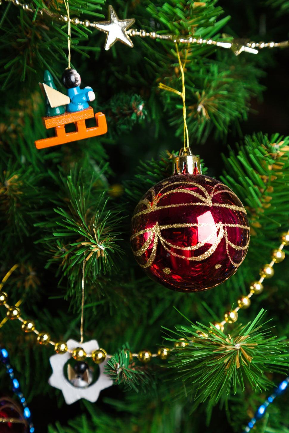 Free Image of Close up of a bauble hanging on the Christmas tree 