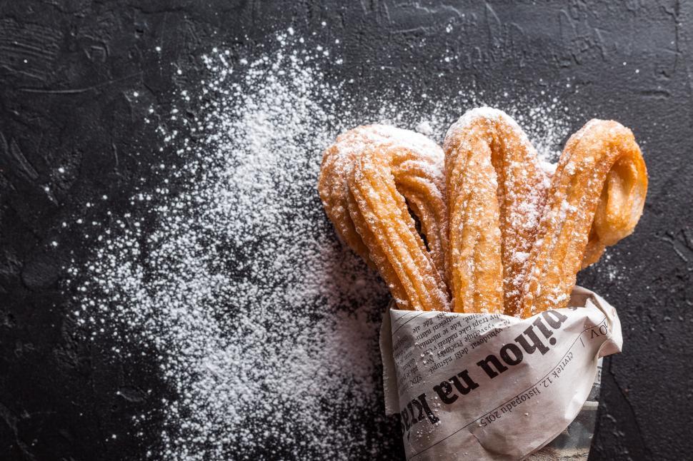 Free Image of Churros with sprinkled sugar powder 
