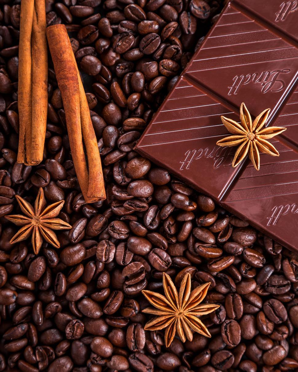 Free Image of Overhead view of coffee beans, cinnamon and chocolate 