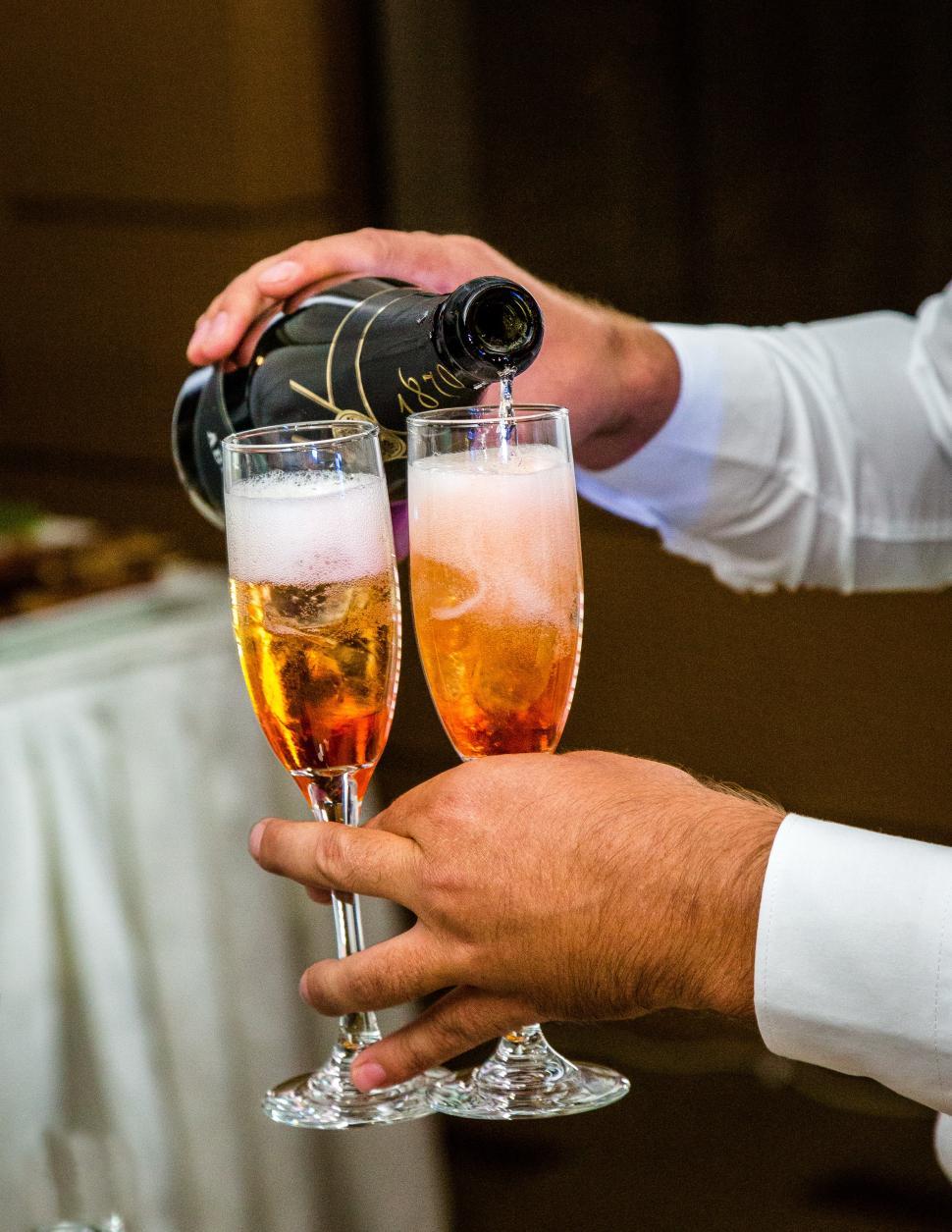 Free Image of Close up of champagne being poured into glasses 
