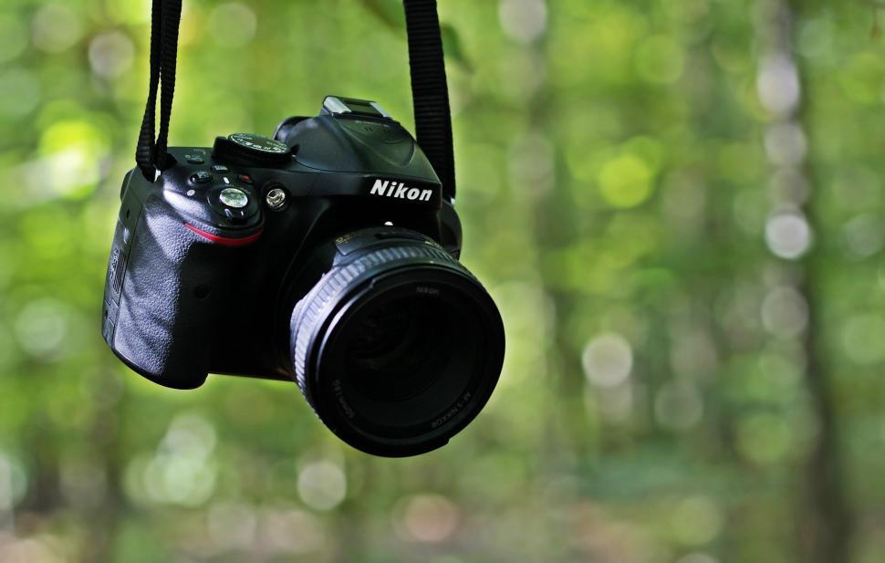 Free Image of Camera Hanging by Strap 