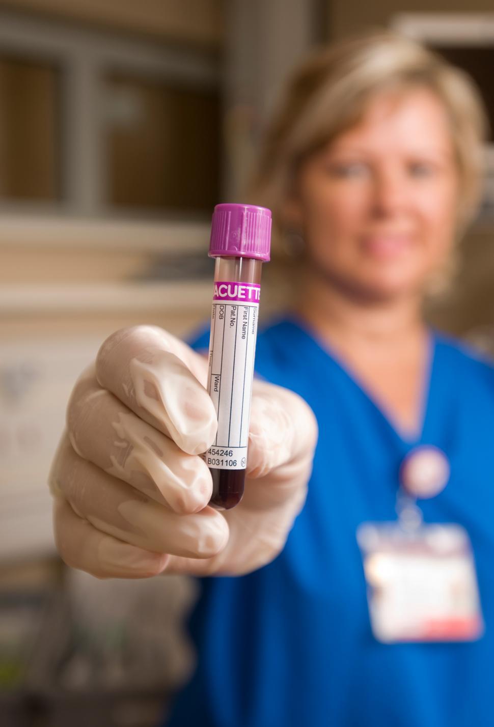 Free Image of Technician with vial of blood for testing 