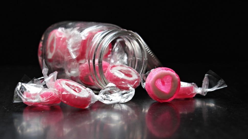 Free Image of Heart candy spilling out or jar 