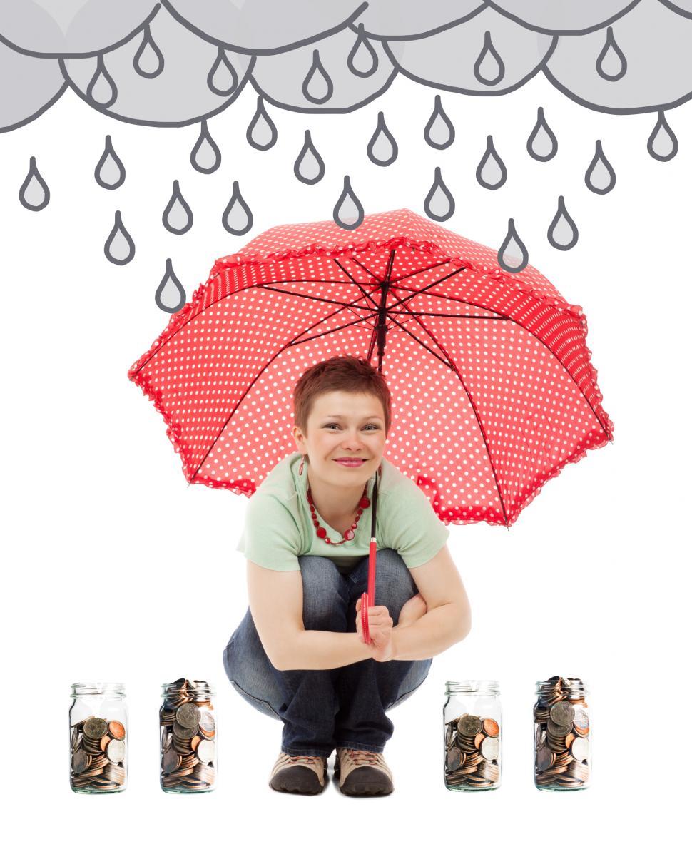 Free Image of Saving for a Rainy Day - Woman in the Rain with Umbrella with Mo 