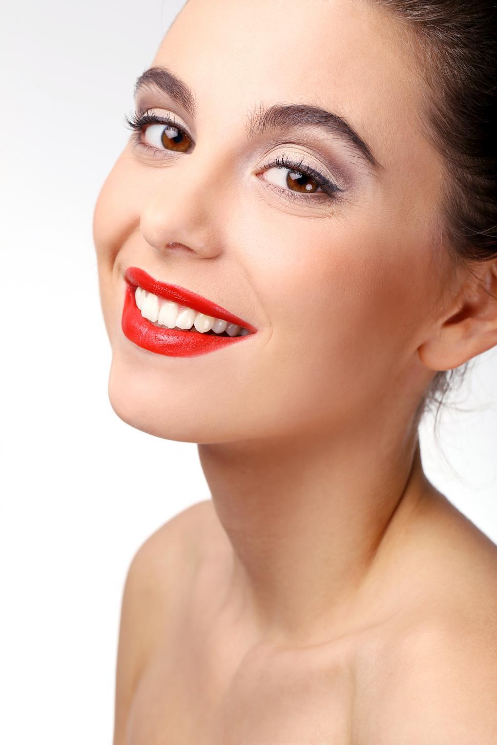 Free Image of Smiling girl with perfect skin and red lipstick 