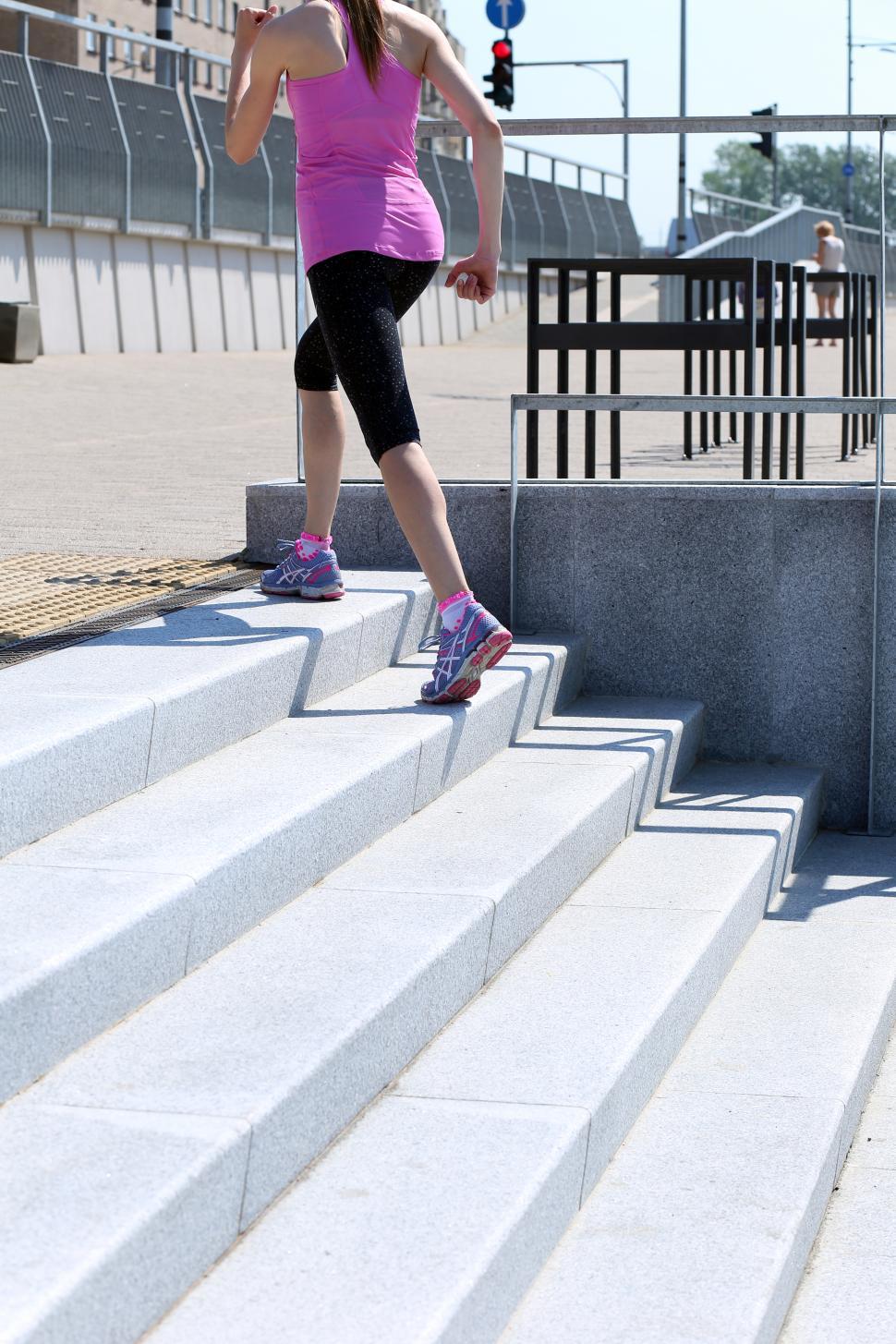 Free Image of Sport. Girl running up stairs 