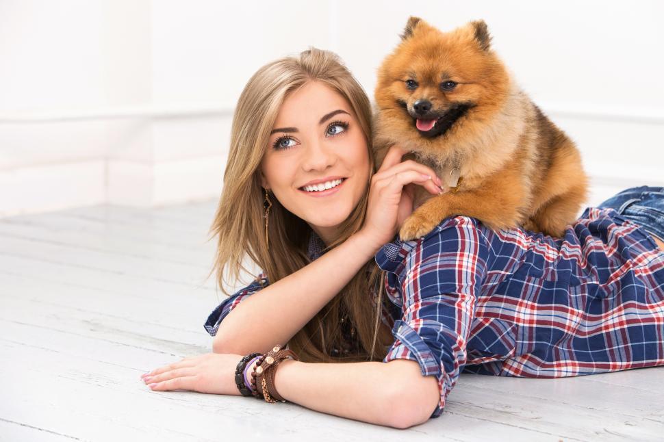 Free Image of Woman lounging with dog 