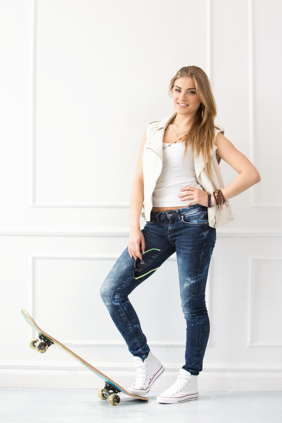 Free Image of Standing woman with skateboard 