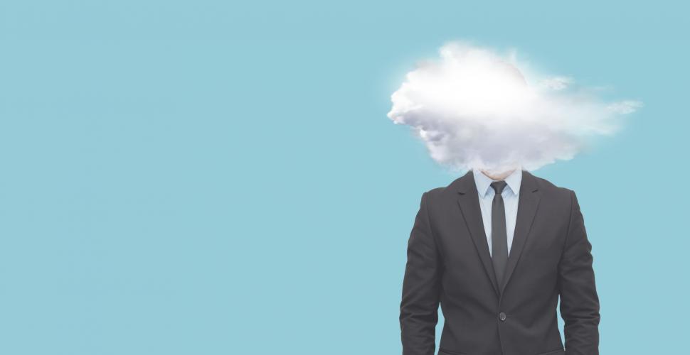 Free Image of Head of Businessman Surrounded by Clouds - With Copyspace 