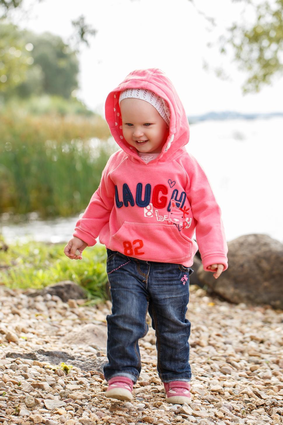 Free Image of Adorable girl by the river 